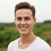 Person with a full head of hair showcasing the effects of scalp micropigmentation in a natural outdoor setting