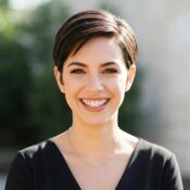 Woman undergoing scalp micropigmentation treatment in a beauty clinic, emphasizing confidence and precision