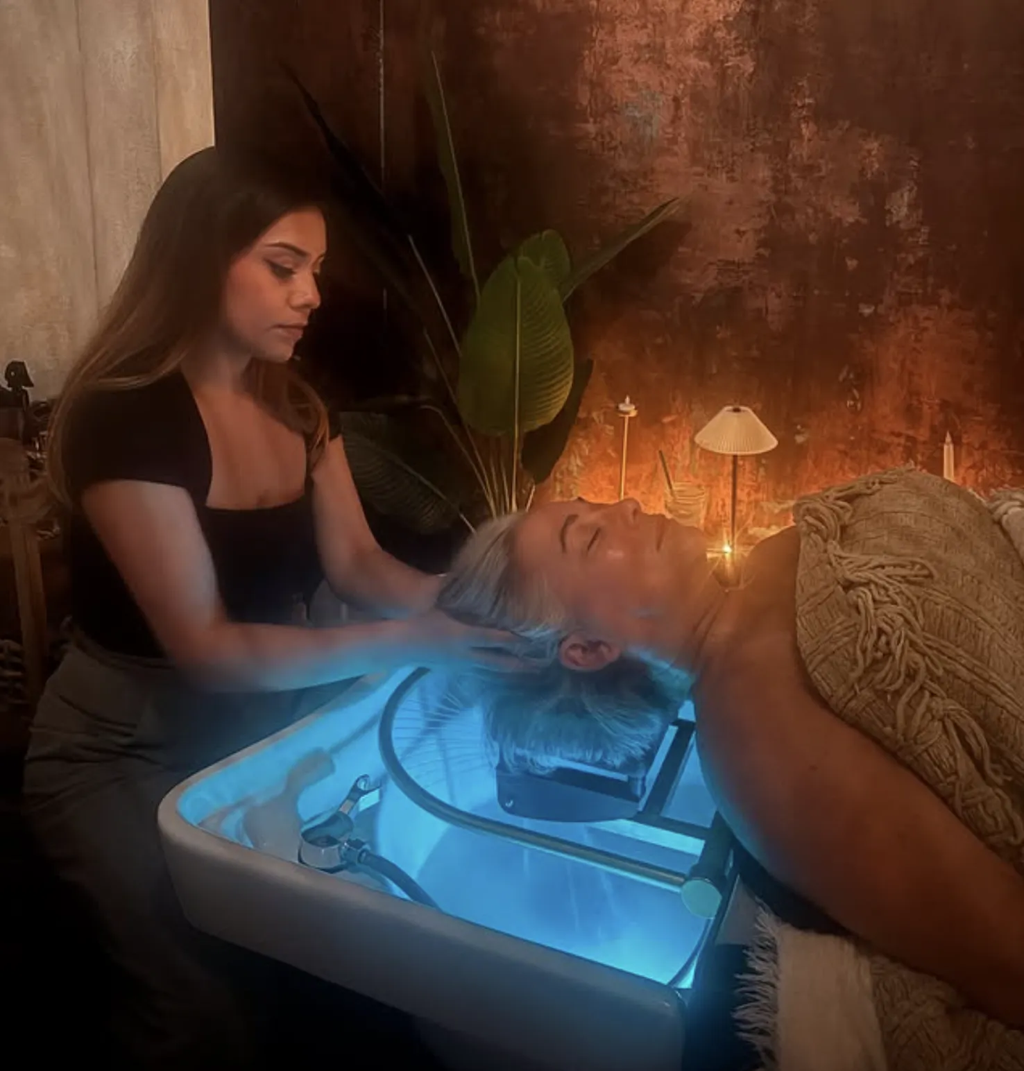 Head spa practitioner consulting with client about scalp health